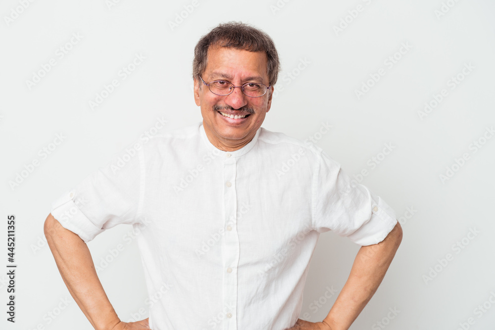 Middle aged indian man isolated on white background confident keeping hands on hips. Middle aged indian man isolated on white background confident keeping hands on hips.