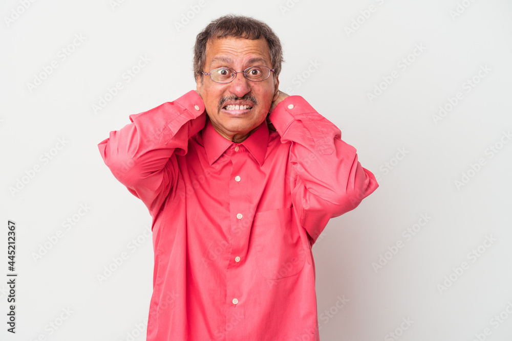 Middle aged indian man isolated on white background screaming with rage. Middle aged indian man isolated on white background screaming with rage.