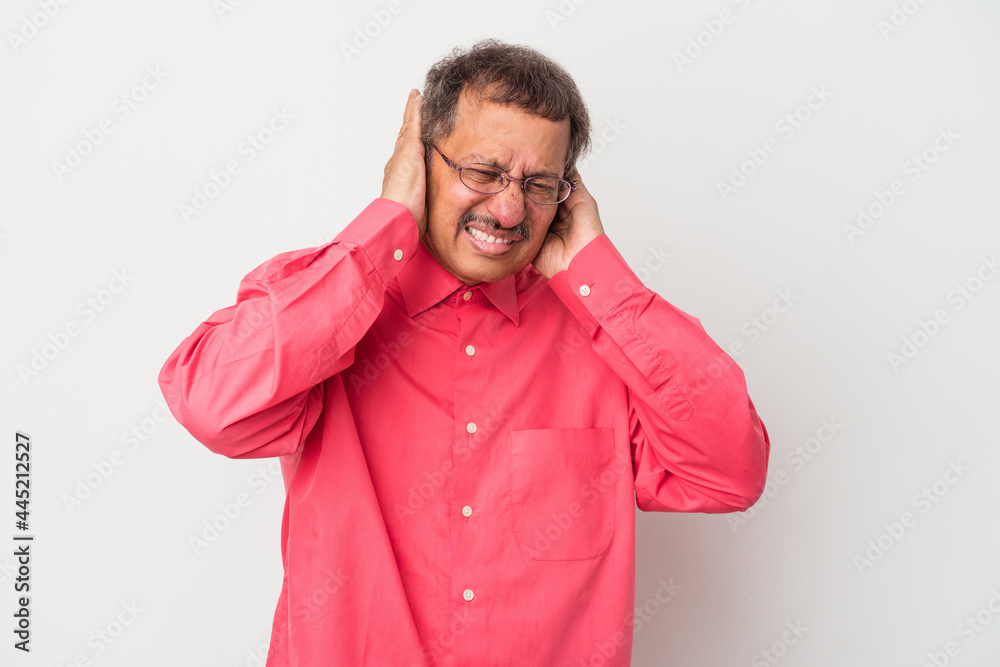 Middle aged indian man isolated on white background covering ears with hands. Middle aged indian man isolated on white background covering ears with hands.