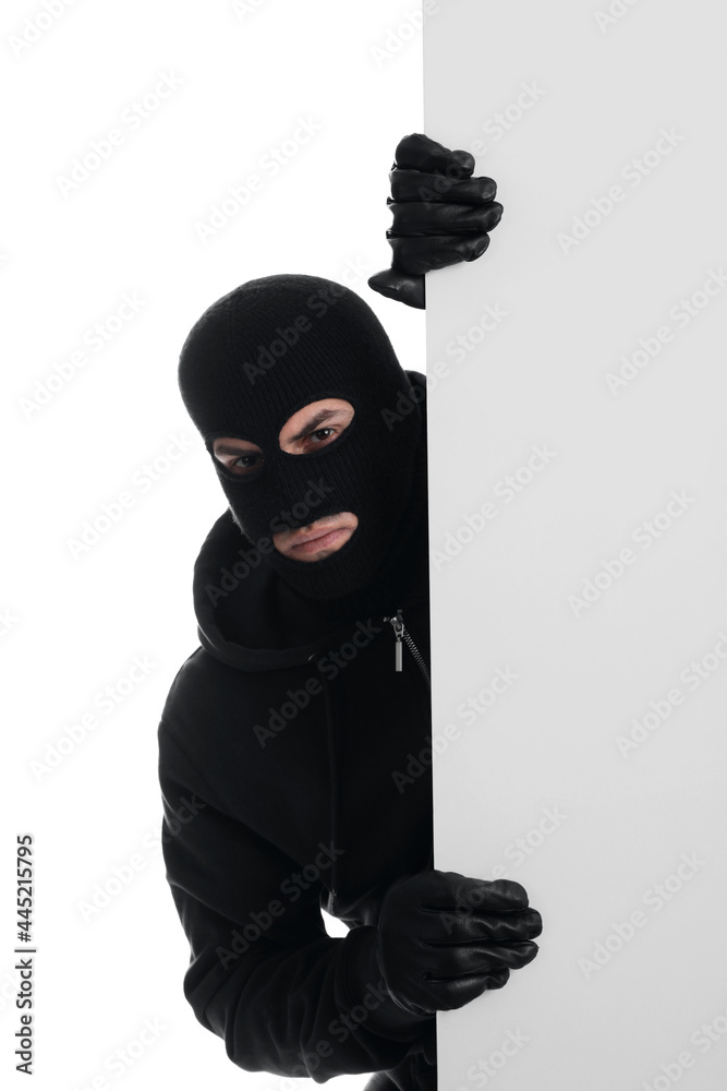 Man wearing black balaclava on white background Man wearing black balaclava on white background