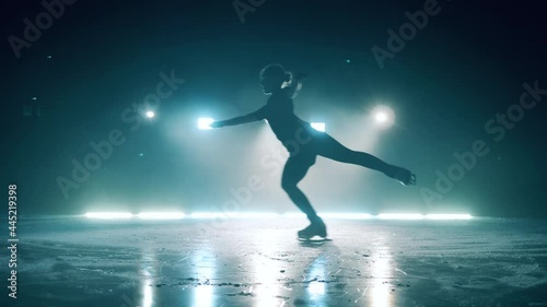 Female figure skater is jumping during skating