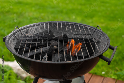 Empty charcoal grill ready for the grill. Grilling outside on a barbecue grill. Outdoor grill party in the summer season. Selective focus.