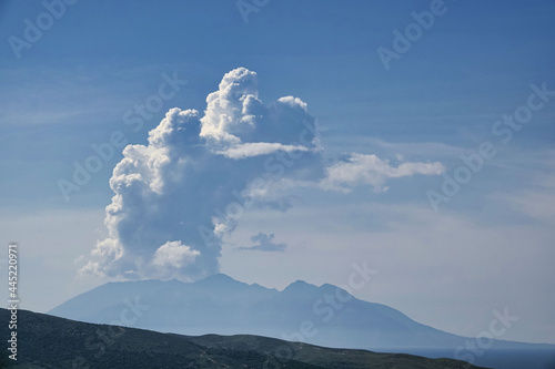 huge white clouds over the mountains and sea with volcanic mountain view 