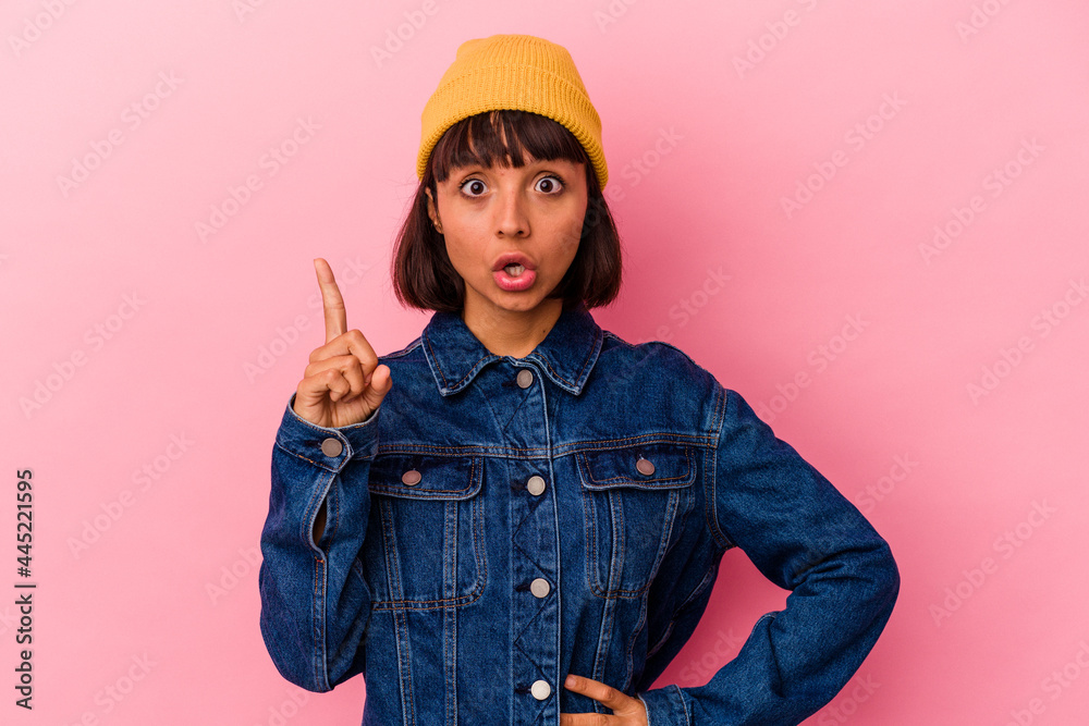 Young mixed race woman isolated on pink background having an idea, inspiration concept. Young mixed race woman isolated on pink background having an idea, inspiration concept.