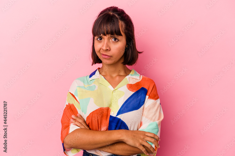 Young mixed race woman isolated on pink background unhappy looking in camera with sarcastic expression. Young mixed race woman isolated on pink background unhappy looking in camera with sarcastic expression.