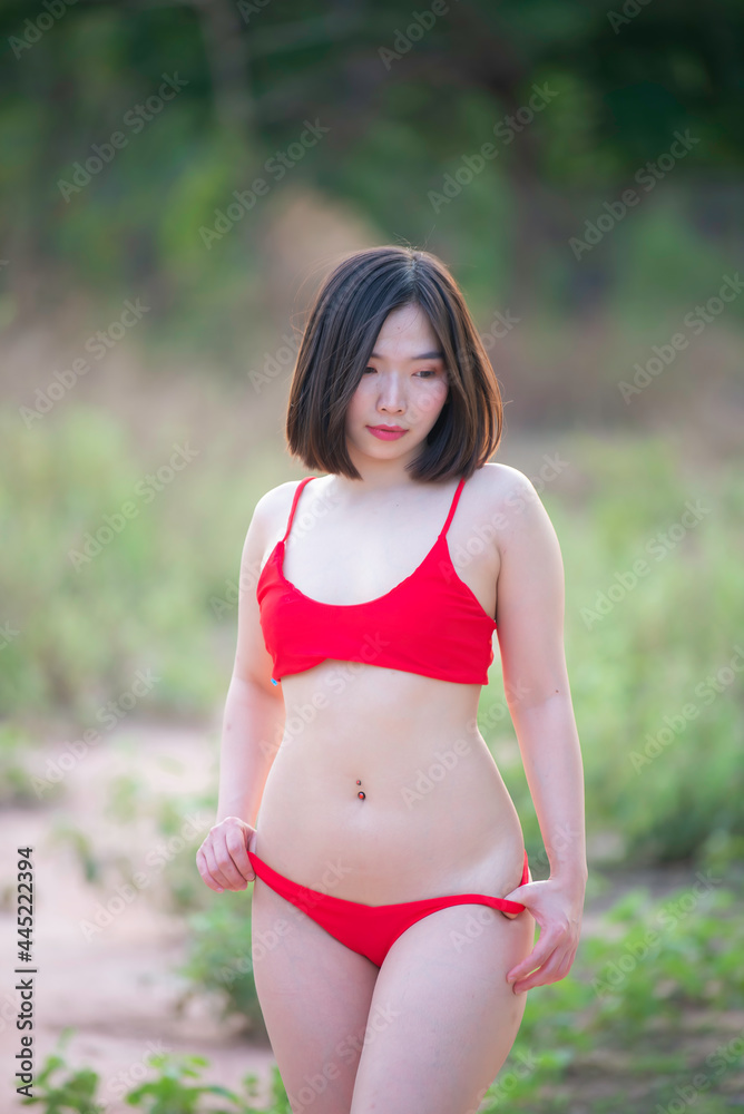 Portrait of asian sexy woman wear bikini at outdoor,Summer concept,Lifestyle of modern women Portrait of asian sexy woman wear bikini at outdoor,Summer concept,Lifestyle of modern women