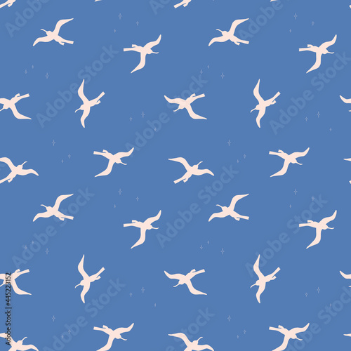 Seamless pattern with white birds on bluebackground. Silhouettes of seagulls flying in the sky. Vector colored endless texture for your designs packing, cards, wrapping paper, textile, towels