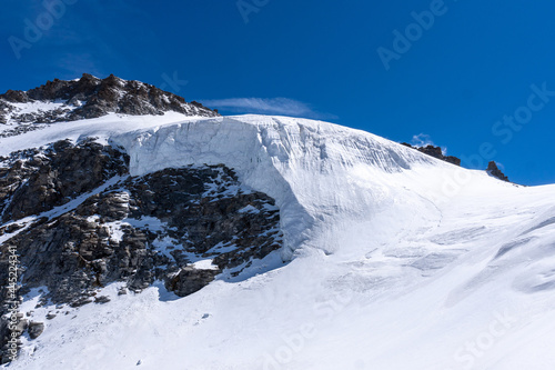 Glacier on the Gran Paradiso mountain in the Aosta Valley in Italy. Massive glacier edge made of ice