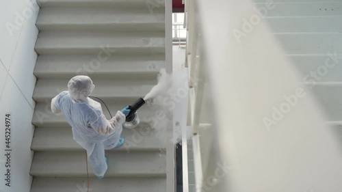sanitizing fog machine for disinfecting railings in building