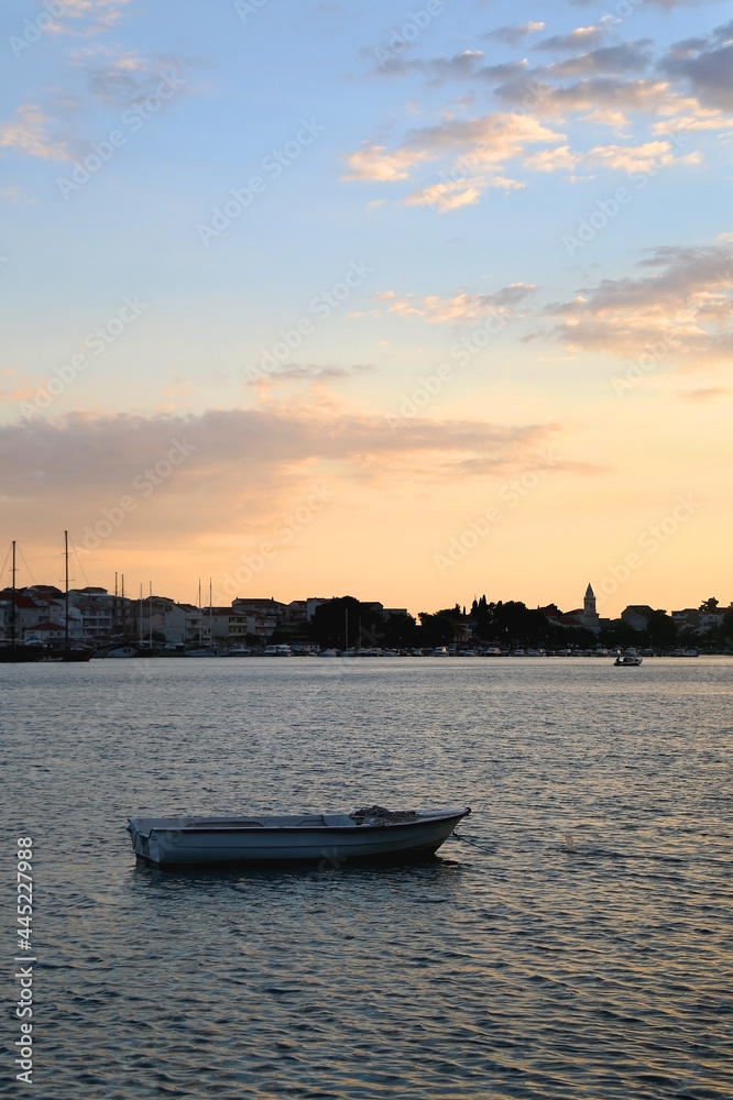 Small boat and beautiful sunset over Stobrec, Croatia. Small boat and beautiful sunset over Stobrec, Croatia.