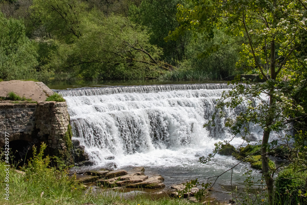 Monsal Dale Weir waterfall in Derbyshire, UK Monsal Dale Weir waterfall in Derbyshire, UK