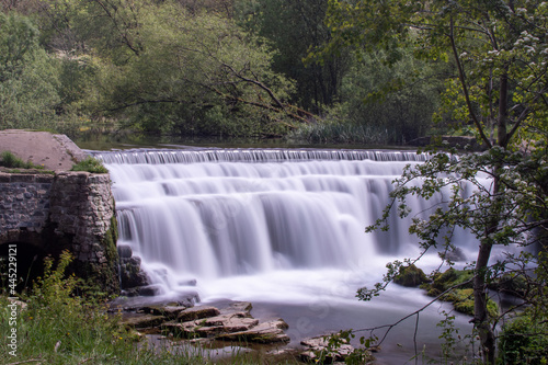 Long exposure photography of Monsal Weir - waterfall at Monsal Dale in the Peak District, Derbyshire