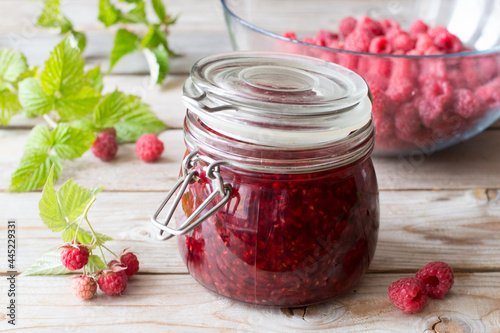 Raspberry  jam in a glass jar