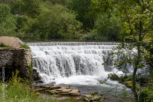 Fototapeta Naklejka Na Ścianę i Meble -  Monsal Dale Weir waterfall in Derbyshire, UK