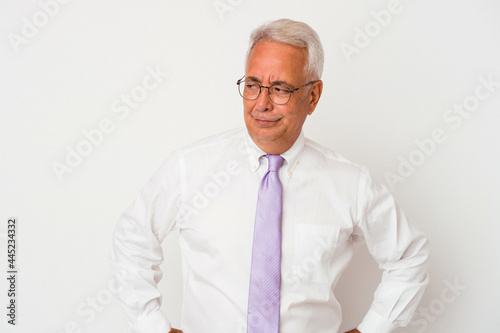 Senior american man isolated on white background confused  feels doubtful and unsure.