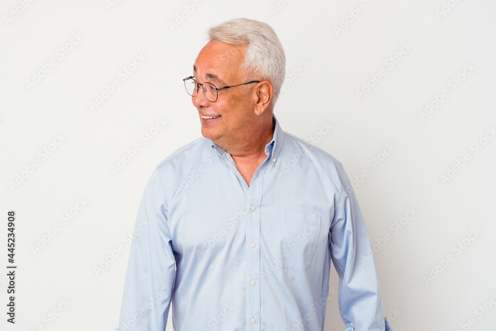 Senior american man isolated on white background looks aside smiling, cheerful and pleasant. Senior american man isolated on white background looks aside smiling, cheerful and pleasant.