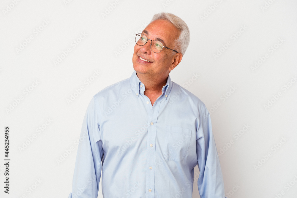 Senior american man isolated on white background relaxed and happy laughing, neck stretched showing teeth. Senior american man isolated on white background relaxed and happy laughing, neck stretched showing teeth.