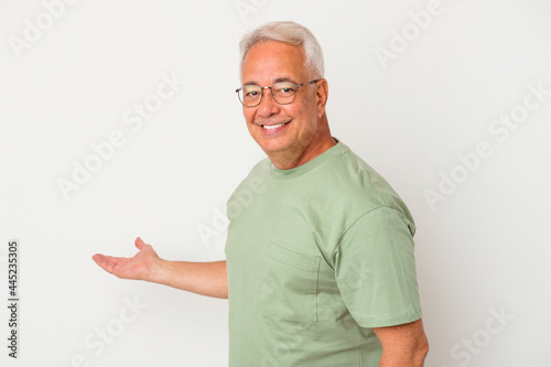 Senior american man isolated on white background showing a welcome expression.