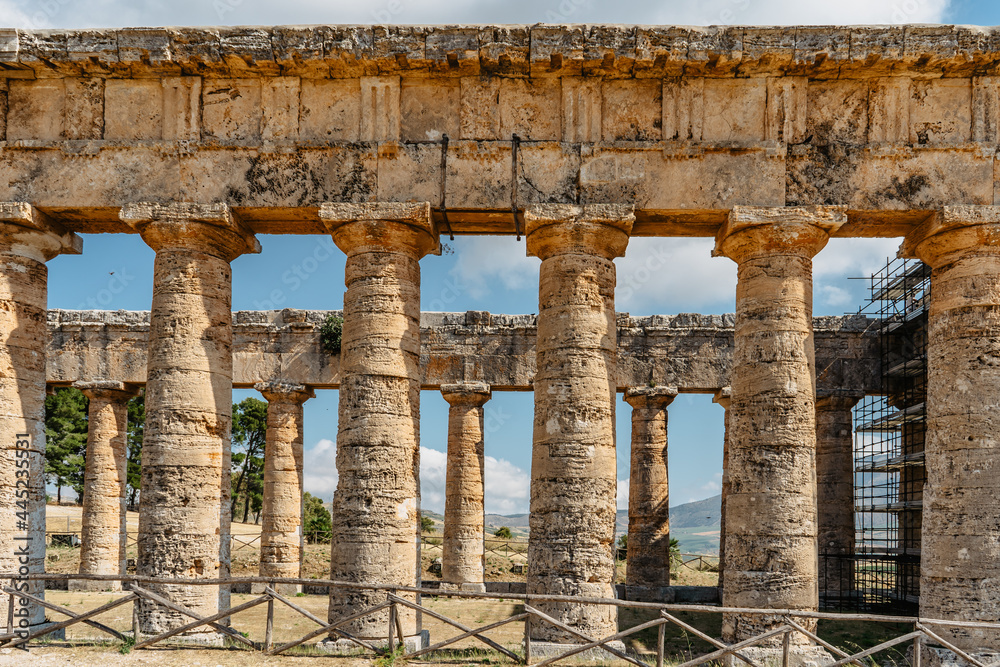 Doric Temple of Segesta,Sicily,Italy.European archeological historical site surrounded by green and quiet countryside.Summer holiday vacation concept.Sightseeing in Europe.Impressive cultural heritage
