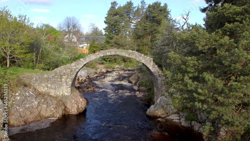 4k footage of the Old Pack Horse Bridge in Carrbridge, Scottish Highlands, UK photo