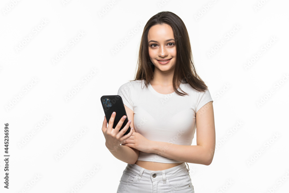 Woman using a mobile phone isolated on a white background Woman using a mobile phone isolated on a white background