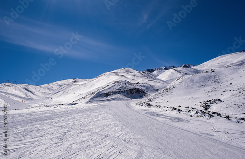 ERCIYES, TURKEY - FEBRUARY 2021: View of the ski slopes and chair lifts at Mount Erciyes ski area, February 2021, in Kayseri, Turkey. Mount Erciyes ski area is one of the longest slope in Turkey