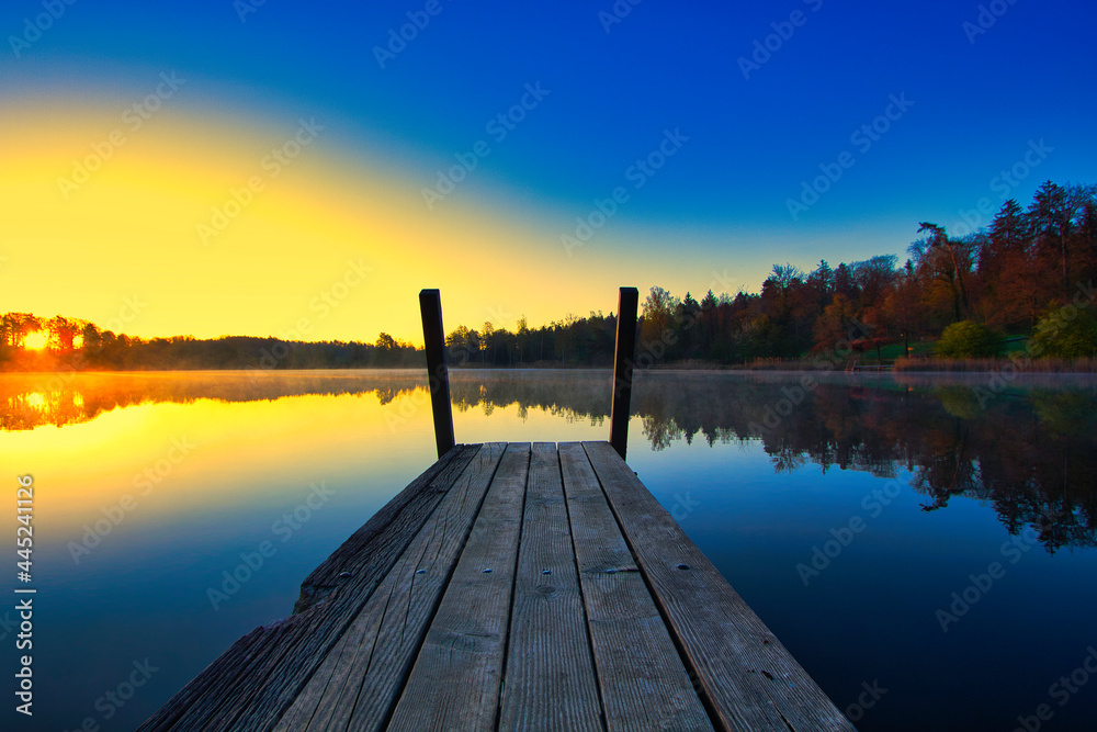 Landscape with Sunrise on the lake with a pier