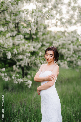 bride in a white dress with a large spring bouquet