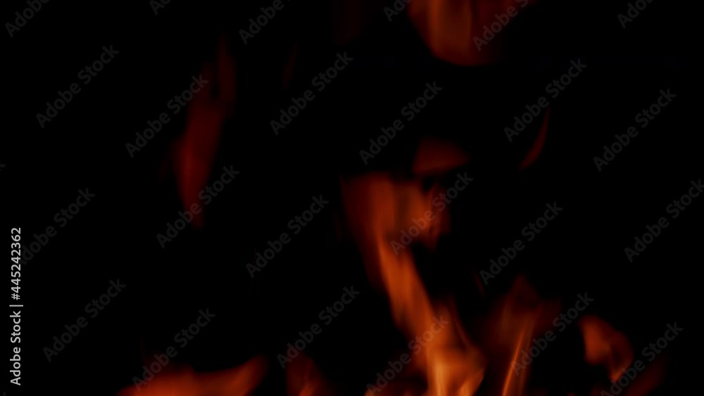 Hellish glow of fire in dark. Logs are on fire. Tongues of flame. Hellish glow of fire in dark. Logs are on fire. Tongues of flame.