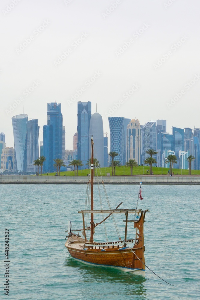 View of Doha with a dhow boat, Qatar