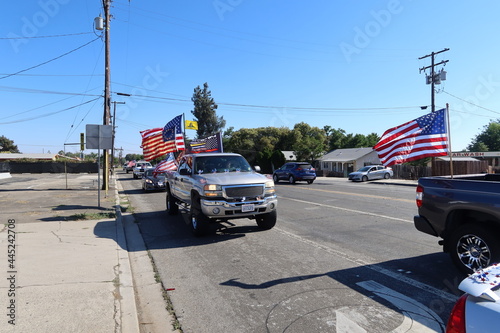 Freedom Parade in a Small City with Flags and Trucks on the 4th of July in Yucaipa, California