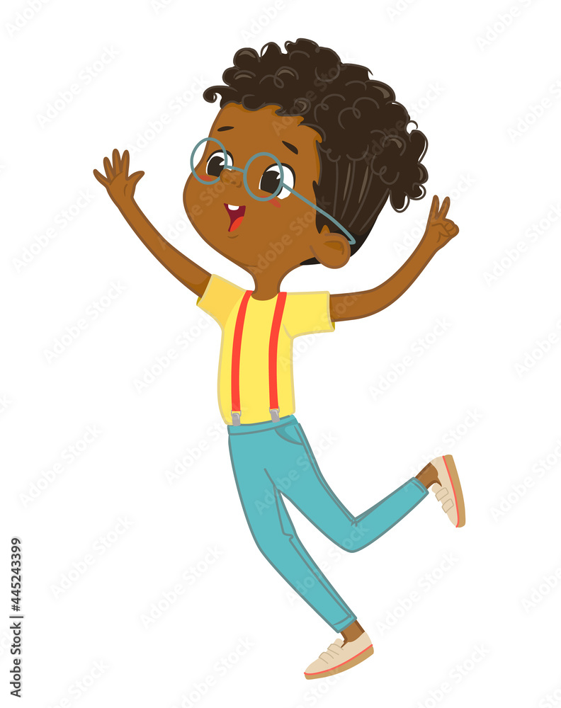 Cute happy African American boy jumping and dancing cheerfully on a ...