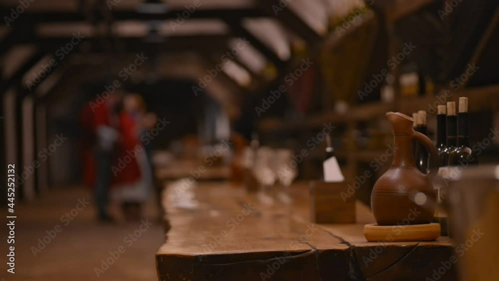 Travel and enjoying drinks pitcher and wine bottles on table Travel and enjoying drinks pitcher and wine bottles on table