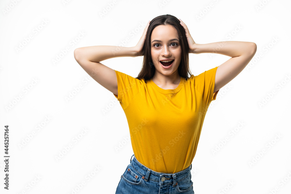 portrait of attractive surprised excited scared screaming teenage, hold hands on head, open mouth with brown long hair, isolated over white background portrait of attractive surprised excited scared screaming teenage, hold hands on head, open mouth with brown long hair, isolated over white background