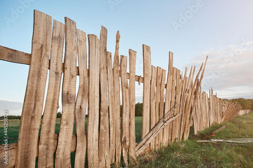 Old wooden plank fence of vertical flat boards