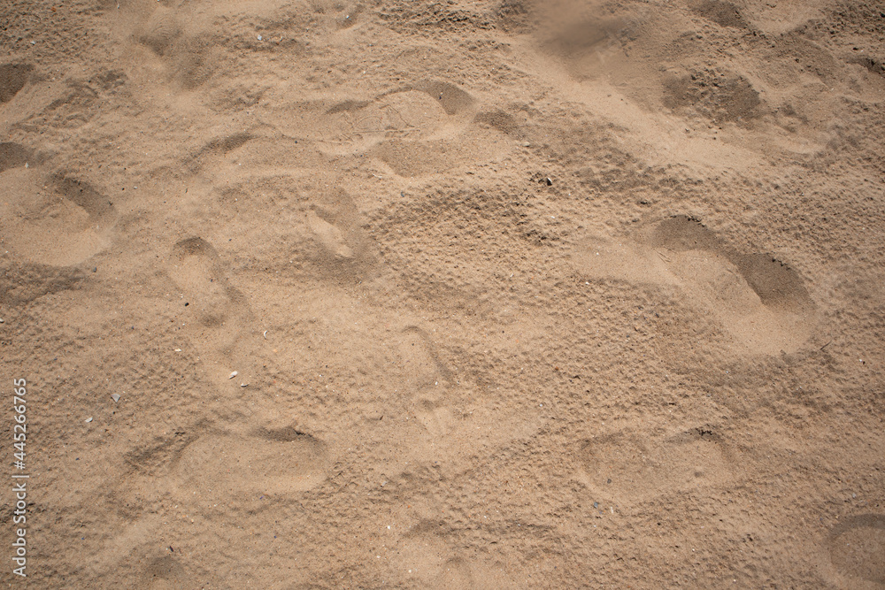Footprint on sand on beach. Sandy beach. Summer, holidays background, vacation concept Footprint on sand on beach. Sandy beach. Summer, holidays background, vacation concept