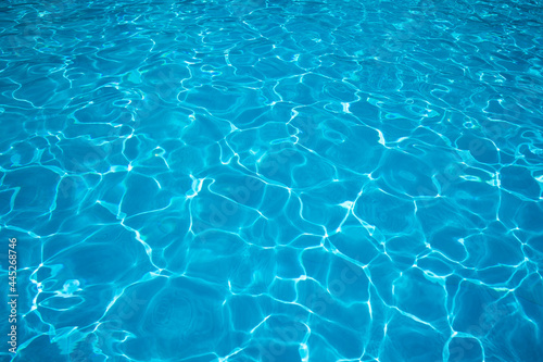 Blue ripped water in swimming pool. water surface background. summer background