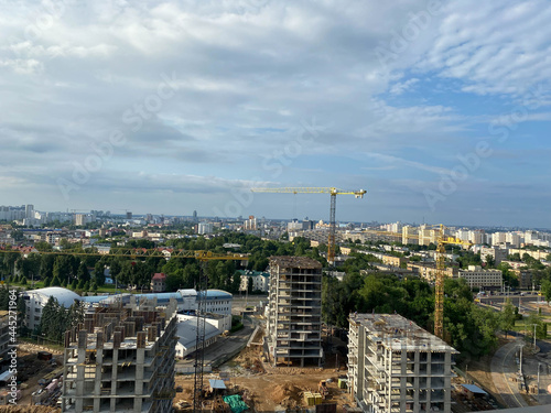 Aerial view construction of a high-rise business center in the big city. Beautiful panoramic landscape of the city at dawn from a height © Aliaksandra
