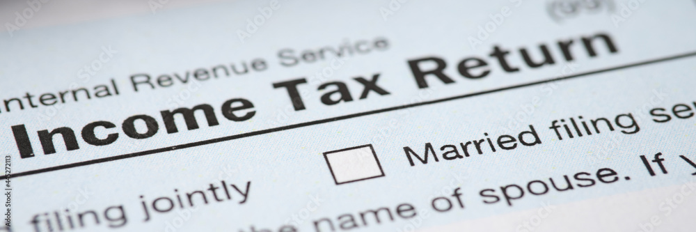 Document with the income tax form is on table Document with the income tax form is on table
