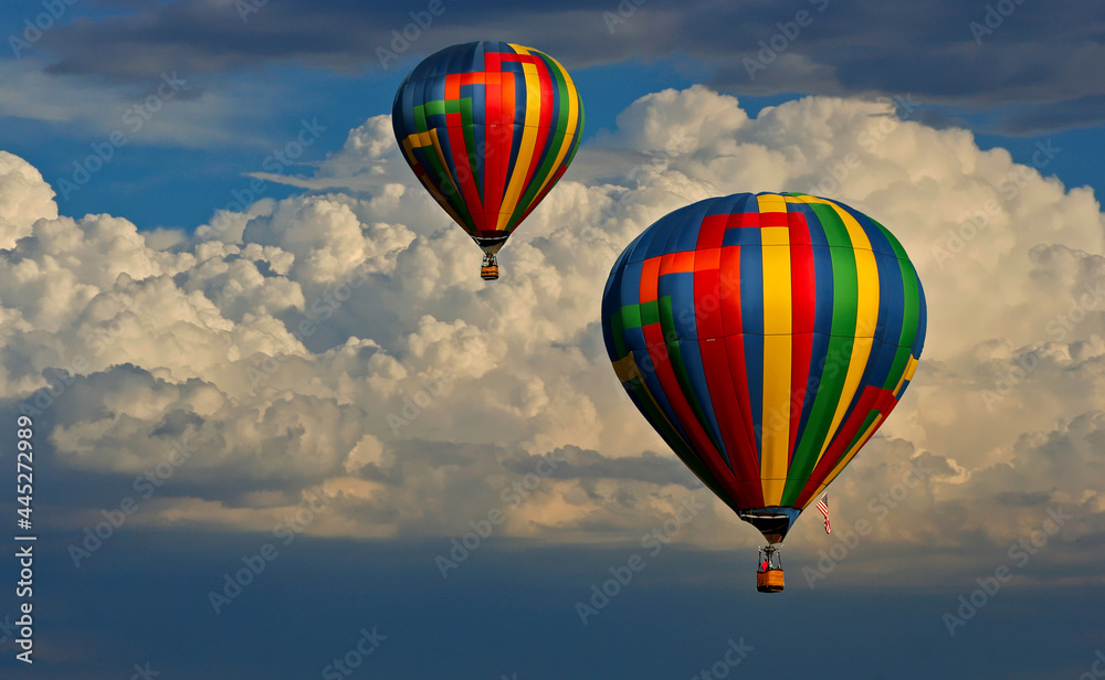 Fototapeta premium Hot air balloons with clouds in the background
