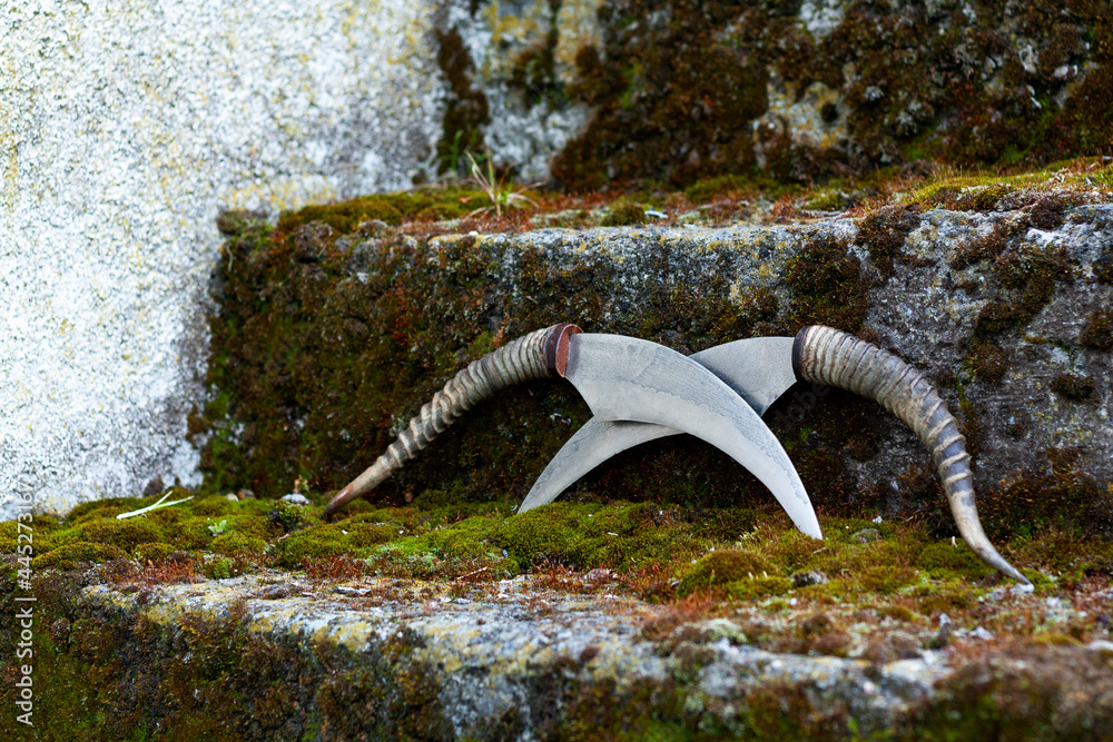 Two knives on the stairs