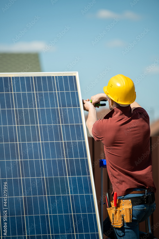 Worker Installing Photovoltaic Panel Worker Installing Photovoltaic Panel