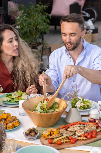 Man Mixing Vegetable Salad