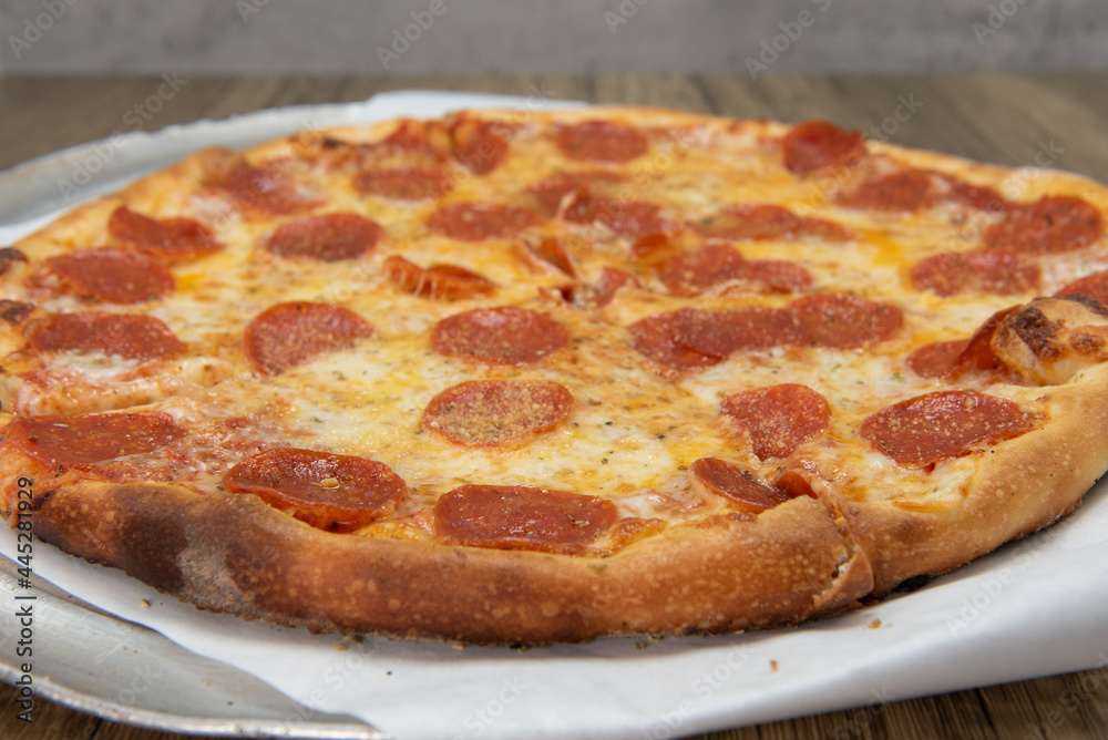 Pepperoni pizza with crispy crust and melted cheese for a perfect lunch date Pepperoni pizza with crispy crust and melted cheese for a perfect lunch date