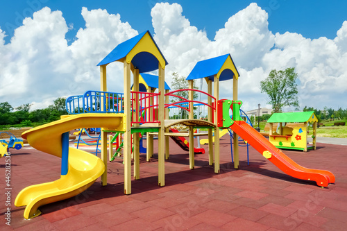 Children playground equipment. Colorful playground empty. Outdoor playground set. Play area. Play yard. Children slide park equipment. School yard. Play ground photo