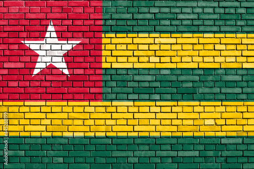 flag of Togo painted on brick wall