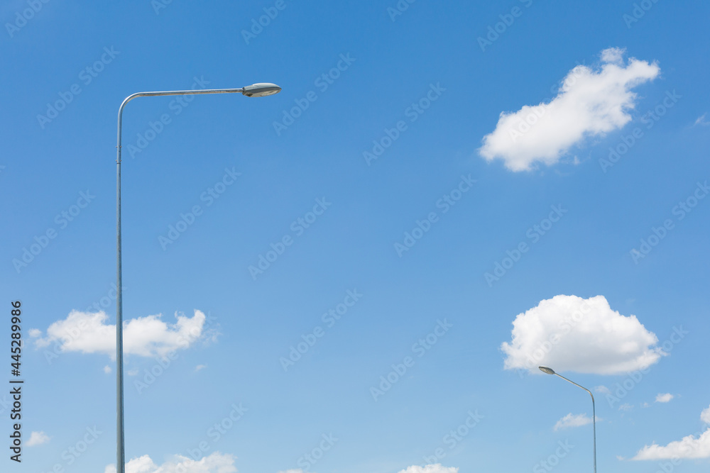 Street lamp on blue sky and clouds background and copy space Street lamp on blue sky and clouds background and copy space