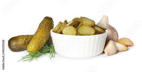 Fotografie Tasty pickled cucumbers, garlic and dill on white background
