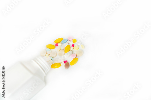 Spilled Pills From white Bottle. Medicine Concept.