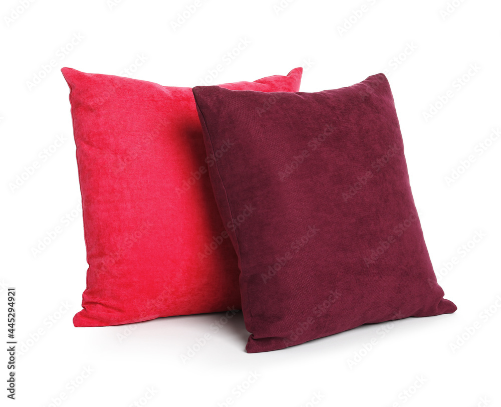 Different colorful decorative pillows on white background